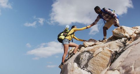 Couple Embracing Adventure by Climbing Rocky Trail - Download Free Stock Images Pikwizard.com