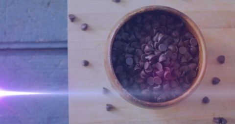 bowl of dark chocolate chips with light flare - Download Free Stock Images Pikwizard.com