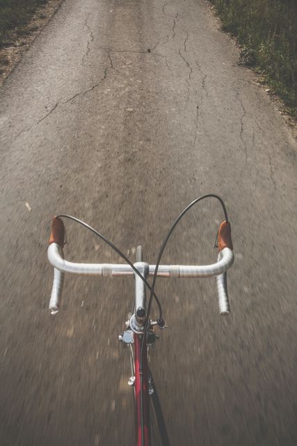 Top View of Riding Bicycle on Empty Road - Download Free Stock Photos Pikwizard.com