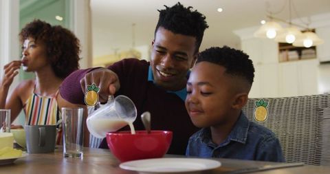 Family Enjoying Healthy Breakfast at Home Together