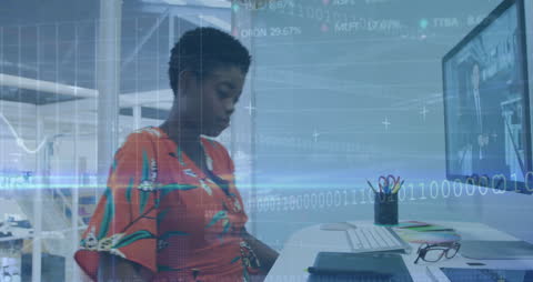 Businesswoman Analyzing Financial Data at Workspace