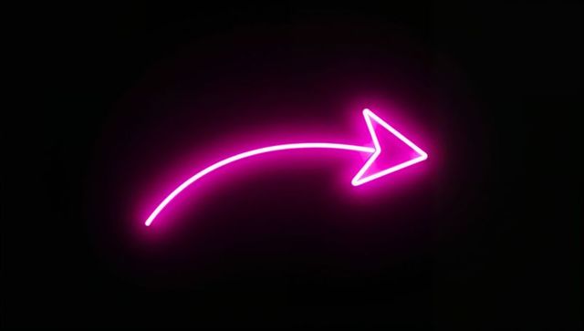Glowing neon pink arrow on dark background