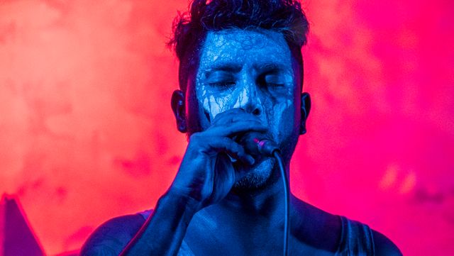 Man Singing in Blue Light with Face Paint - Download Free Stock Photos Pikwizard.com