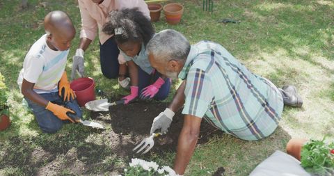 Kids and Grandfather Bond Through Gardening Outdoor Family Activity