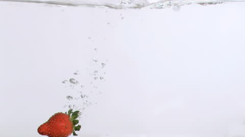 Strawberry Submersion in Clear Water