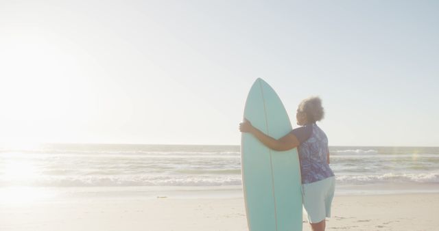 Woman Holding Surfboard at Beautiful Sunset Beach - Download Free Stock Images Pikwizard.com