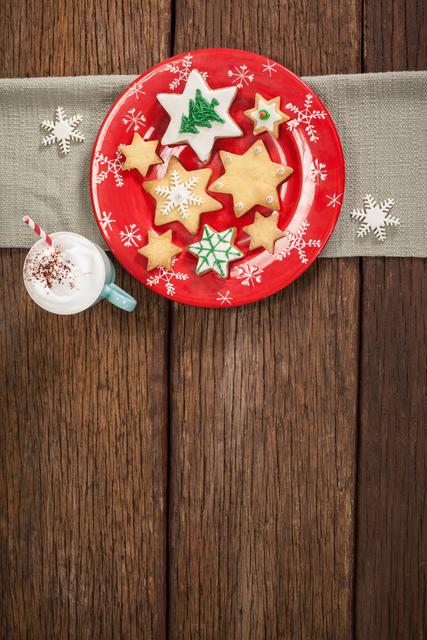 Sweet food and cappuccino decorated on wooden table during christmas time