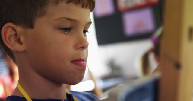 Focused Young Boy Painting on Easel in Classroom - Download Free Stock Images Pikwizard.com