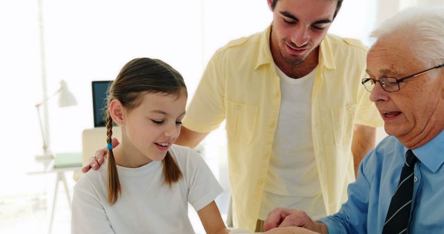 This stock photo shows a pediatrician checking a young girl's arm while her father stands nearby to support her. It can be used for medical-related content such as blogs or articles on child healthcare, family health topics, parenting, and promotional materials for health services.