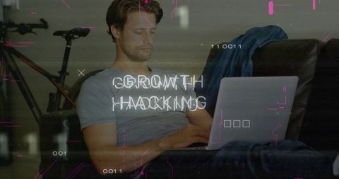 Man on Laptop Exploring Growth Hacking Concepts at Home