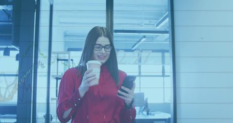 Businesswoman with Smartphone and Coffee in Modern Office