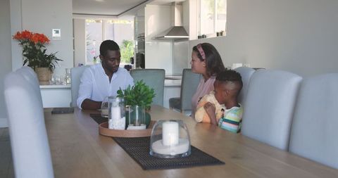Diverse Family Engaging in Heartfelt Discussion at Home