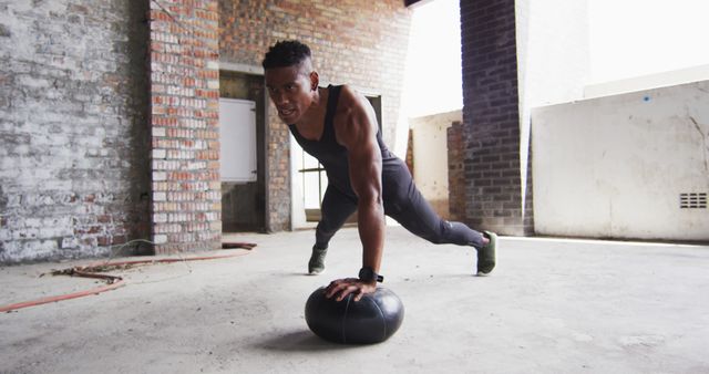 Focused Athlete Performing Medicine Ball Push-Up in Urban Setting - Download Free Stock Images Pikwizard.com