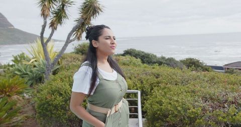 Tranquil Coastal Adventure with Woman Gazing Horizon
