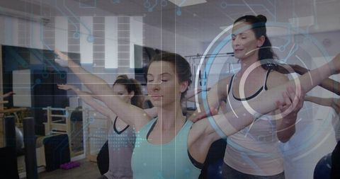 Women practicing pilates balance and core training in studio with digital wellness overlay