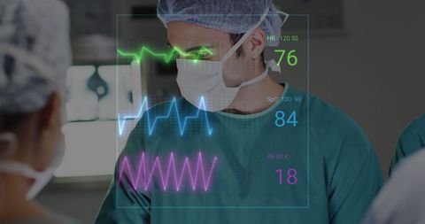 Surgeon monitoring vital signs during surgery