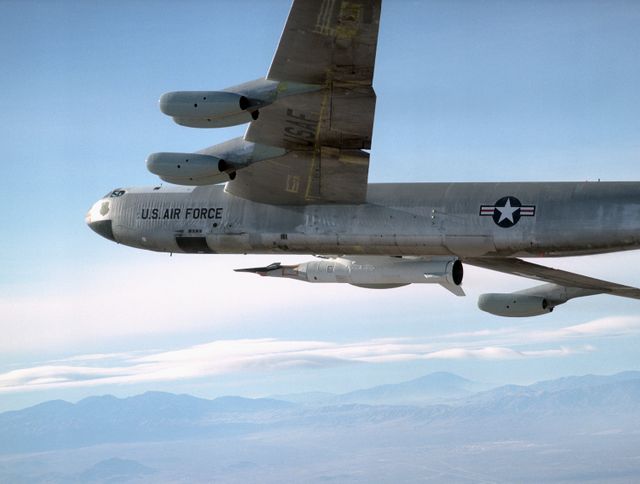 Historic NASA B-52 mother ship is transporting X-43A and Pegasus booster rocket during a crucial flight from Edwards Air Force Base in 2004. Perfect for illustrating aerospace engineering and flight tests, showcasing advanced aviation technology, highlighting U.S. Air Force operations, or including in historical reviews of flight test missions.