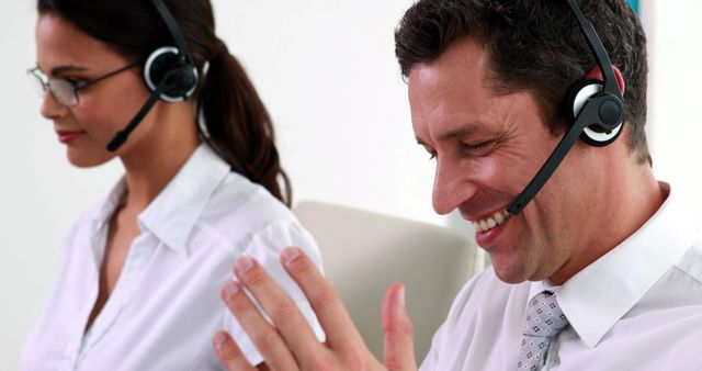 Cheerful Customer Service Representatives Wearing Headsets - Download Free Stock Images Pikwizard.com