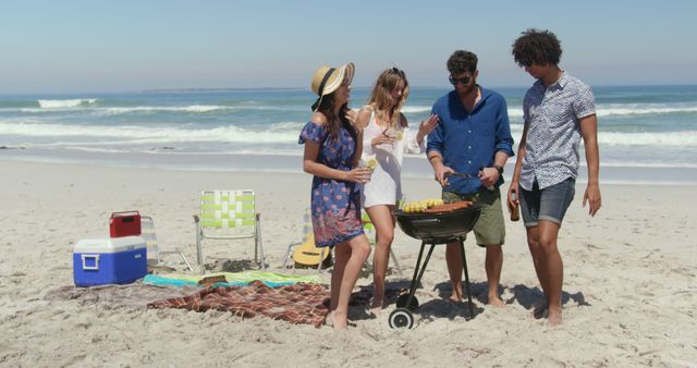 Group of friends grilling food while enjoying a sunny summer day by the ocean. Great for demonstrating concepts of leisure time, outdoor activities, vacation, and social gatherings. Ideal for use in advertisements for travel agencies, barbecue equipment, or social media posts on summer activities.