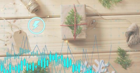 Kraft gift with evergreen sprig and red twine on light wooden table with cyan data overlay