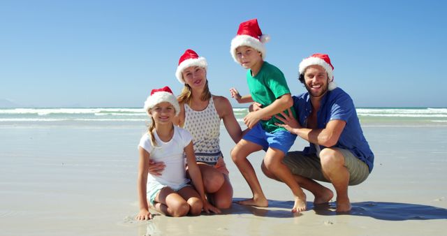 Family Celebrating Christmas on Beach Wearing Santa Hats - Download Free Stock Images Pikwizard.com