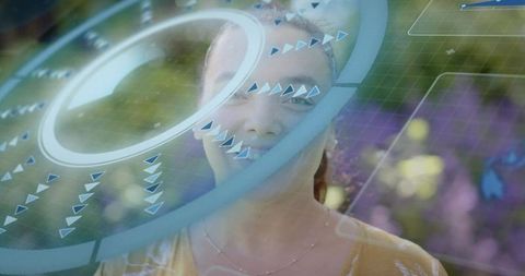 Smiling woman interacting with holographic augmented reality HUD in garden lifestyle scene
