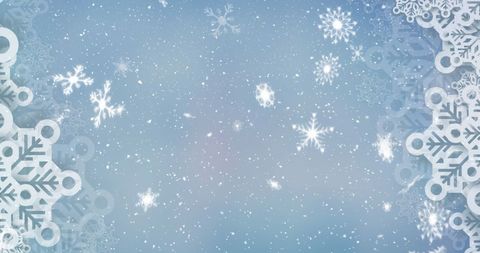 Snowflakes Gently Falling on Blue Winter Background