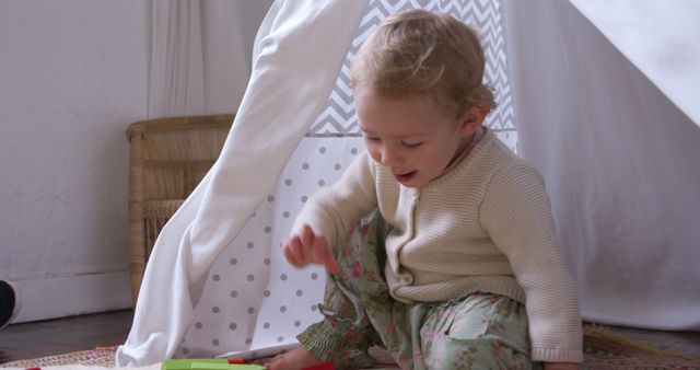 Toddler Playing Inside Homemade Tent with Toys in Cozy Room - Download Free Stock Images Pikwizard.com