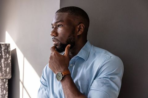 Contemplating professional in office lighting