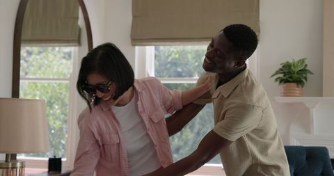 Friends preparing colorful decorations for a wedding celebration