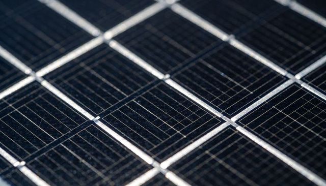 Macro solar cell panel revealing busbars, gridlines and interconnect ribbons for photovoltaic design