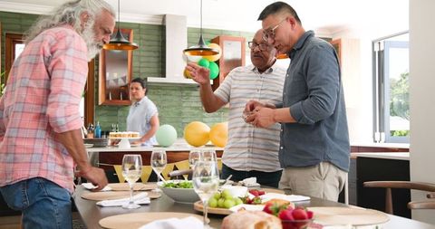 Diverse Senior Friends Enjoying Dinner Party Celebration