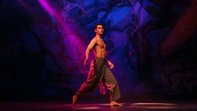 Shirtless Contemporary Dancer Moving Through Magenta and Blue Stage Lights With Dramatic Haze