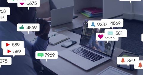 Watching man leaning into laptop during virtual meeting with engagement badges and devices