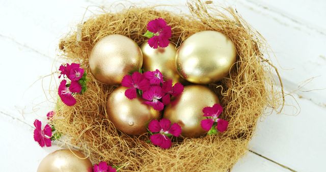 Golden Easter Eggs in Nest with Pink Flowers on White Wooden Background - Download Free Stock Images Pikwizard.com