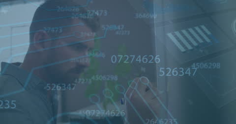 Businessman Analyzing Digital Data with Holographic Charts