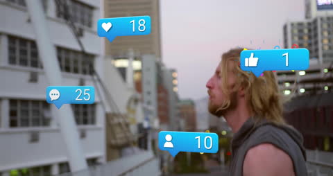 Man Engaged with Social Media Notifications in City