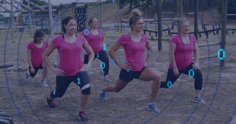 Women exhibiting teamwork during outdoor fitness challenge