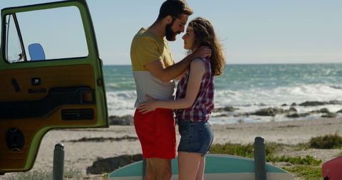 Romantic couple embracing at scenic beach