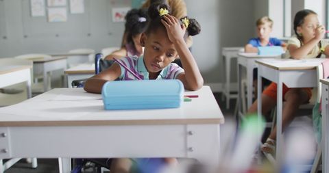 Focused African American Girl Studying in Inclusive School Classroom - Download Free Stock Images Pikwizard.com