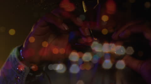 Vibrant Crowd Dancing with Colorful Bokeh Lights