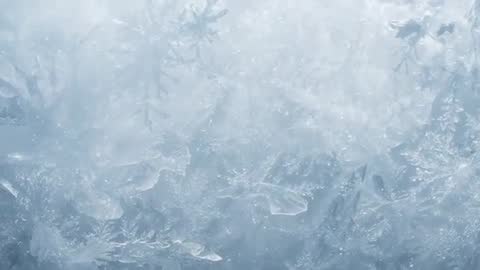 Shifting Backlight Revealing Frosted Ice Crystal Patterns Forming on Window Surface