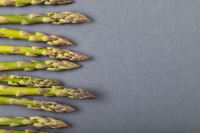 Overhead view of asparagus on gray background, copy space. unaltered, food, healthy eating, studio shot and organic.