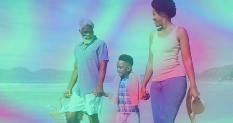 Family Enjoying Beach Walk with Picnic