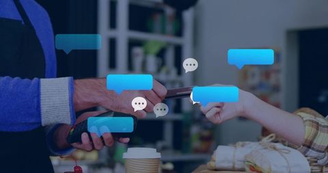 Processing contactless cafe payment, serving clerk and customer tapping phone