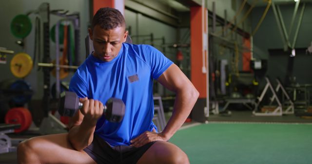 Athletic Man Lifting Dumbbell in Modern Gym - Download Free Stock Images Pikwizard.com