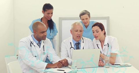 Medical Team Collaborating on Patient Data Analysis with Tech Integration