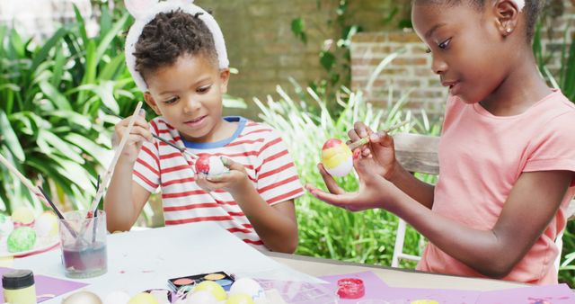 Children Painting Easter Eggs Outdoors at Craft Table - Download Free Stock Images Pikwizard.com