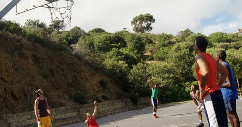 Basketball Player Taking a Free Throw in Outdoor Court