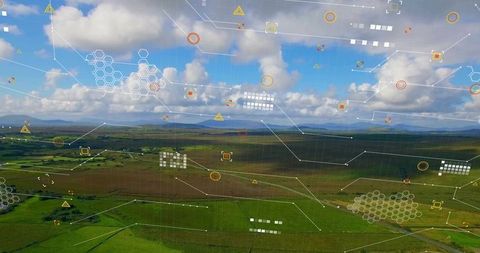 High-angle drone view of farmland with digital HUD overlay for precision agriculture